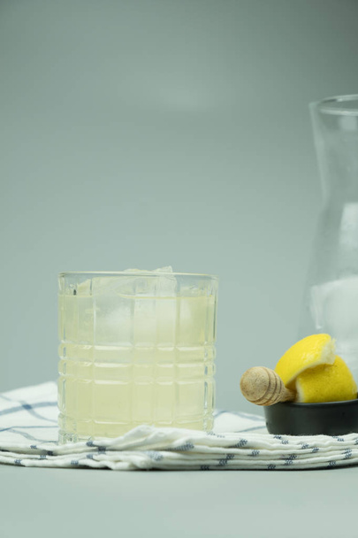 Cocktail glass of lemonade and ice cubes - Φωτογραφία, εικόνα