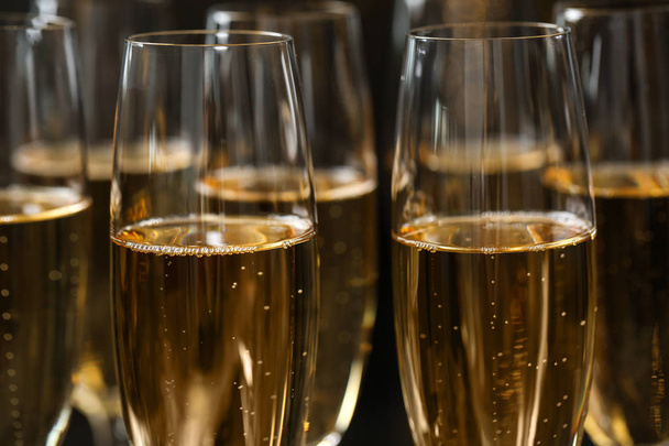 Many glasses of champagne as background, closeup view - 写真・画像