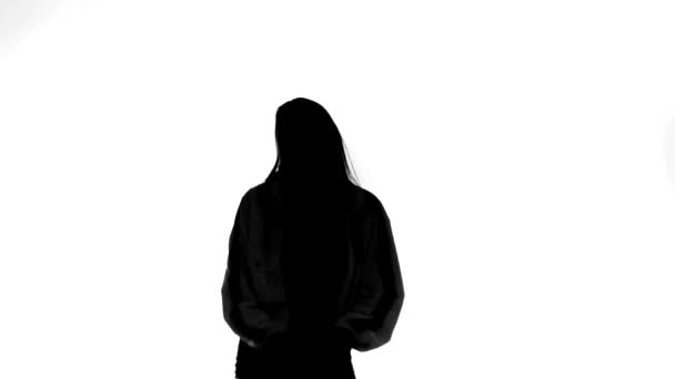 black silhouette on white background, girl dancing hip hop, street dance - Footage, Video
