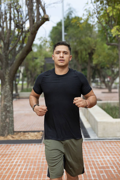 Man doing fitness in outdoor park - Photo, image