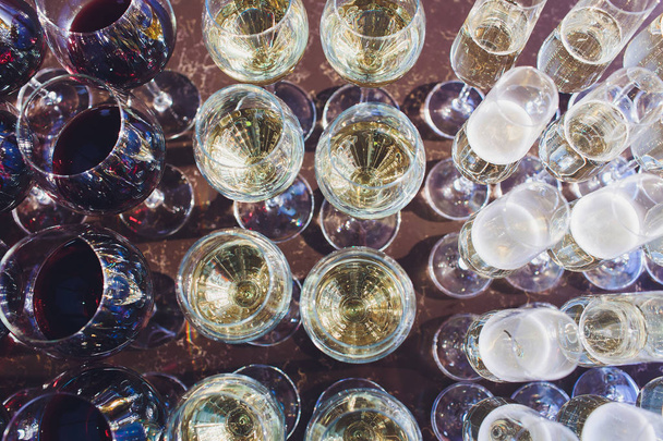 catering services. glasses with wine in row background at restaurant party. - Photo, image