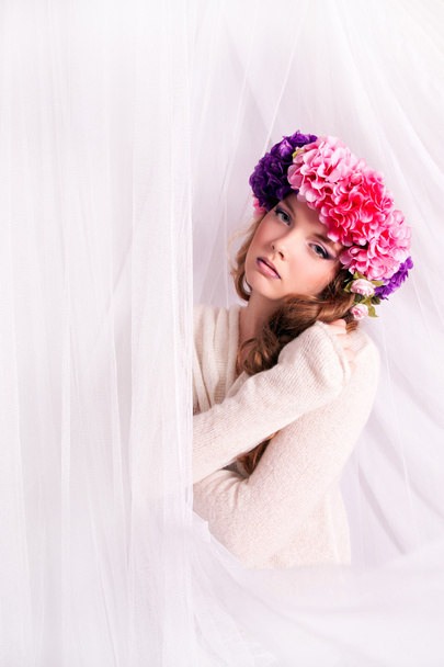 Girl with a wreath of flowers in her hair. - Photo, Image