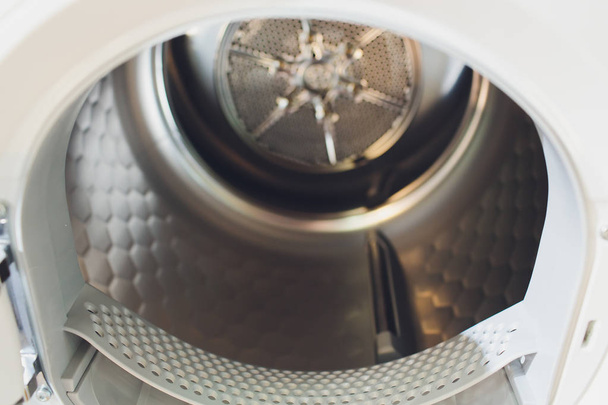 Washing machine drum interior, Internal view of an empty washing machine drum. - Φωτογραφία, εικόνα