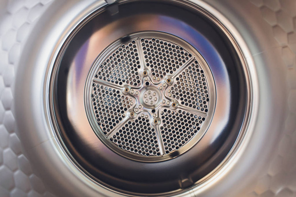 Washing machine drum interior, Internal view of an empty washing machine drum. - Foto, imagen