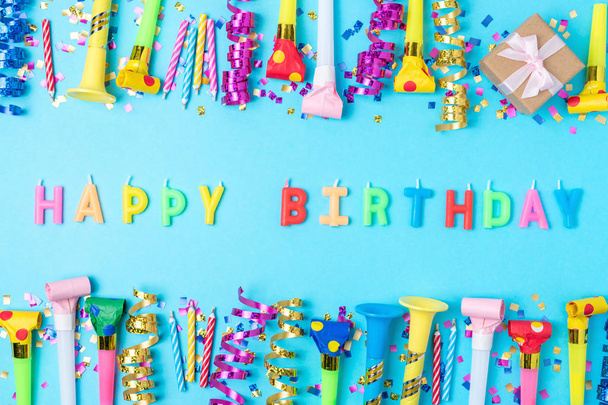 Colorful celebration background with various party confetti, streamers and decoration. Minimal party concept. Flat lay. - Photo, image