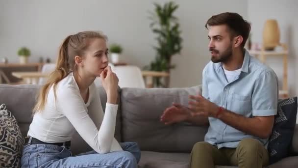 Angry stubborn young couple arguing at home fighting concept - Video