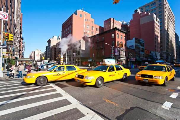 NEW YORK - MARCH 21. Taxicabs between the 7th Av. and 23th st. - 写真・画像