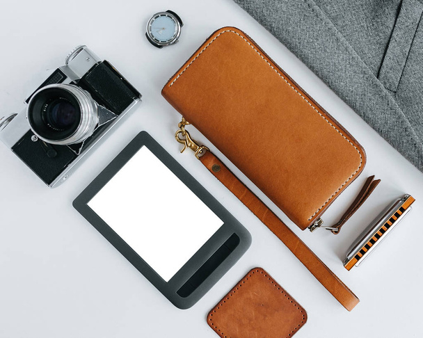 Leather goods with jacket and e-book on a white background - Φωτογραφία, εικόνα