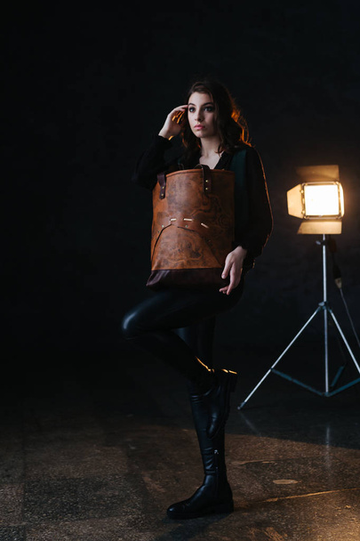 Leather bag with a model - Φωτογραφία, εικόνα