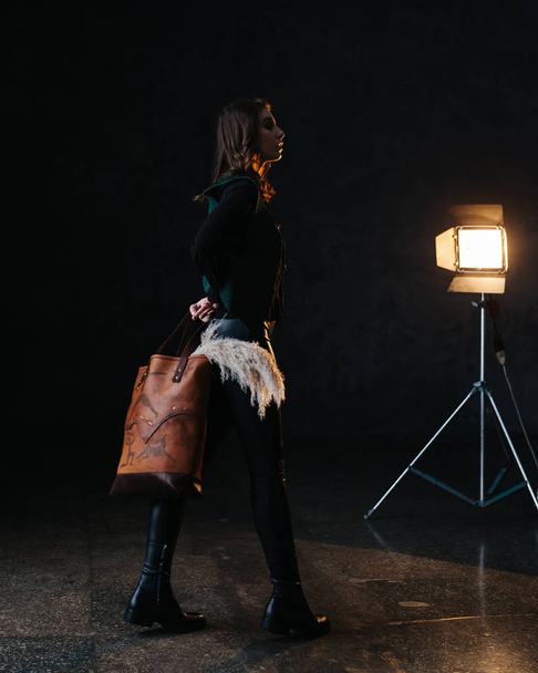 Leather bag with a model - Foto, Bild