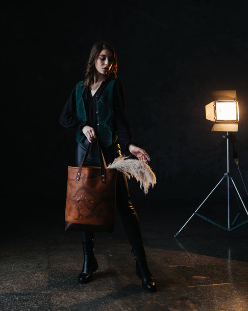 Leather bag with a model - Фото, изображение
