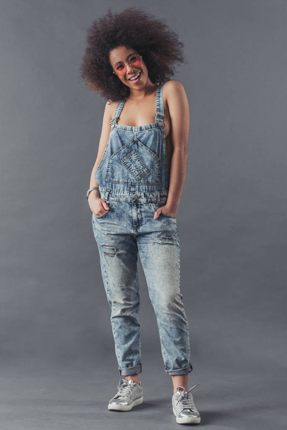 Afro American woman in jean overalls - Фото, изображение