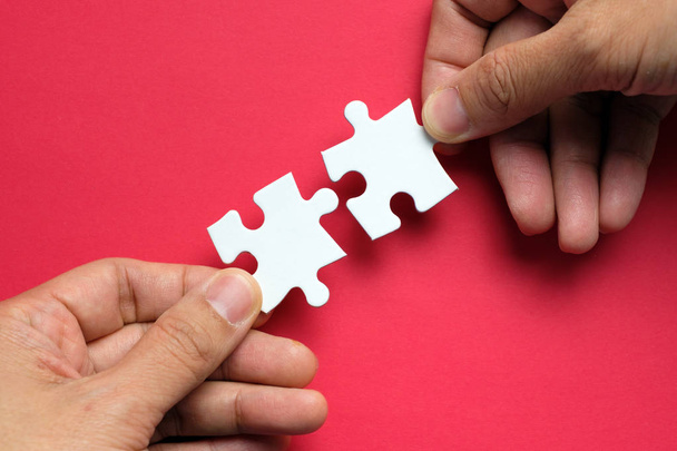 Partnership concept with hands putting puzzle pieces together - Foto, imagen