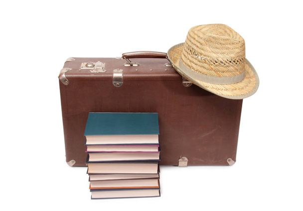 Old books and leather suitcase on a white background - Foto, imagen