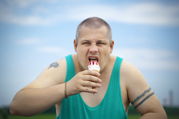Angry man with ice cream in the hands of - Photo, Image