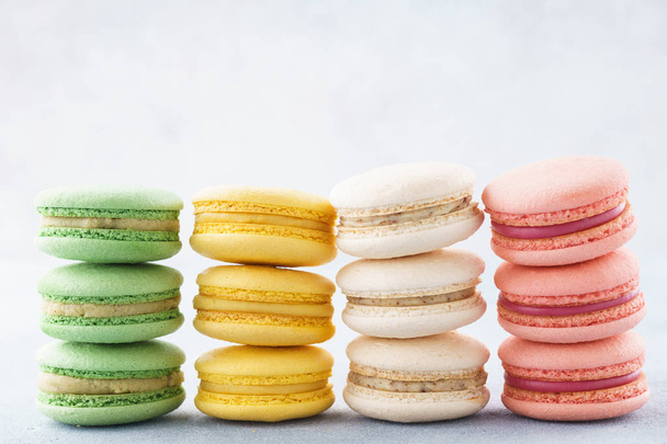 Stacks of various colorful macarons in a row. Creative design. - Foto, Imagem