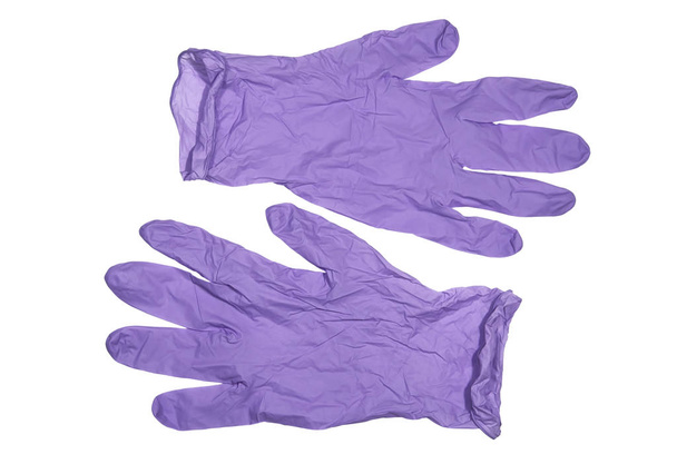 Guantes médicos de látex de color violeta sobre fondo blanco
 - Foto, Imagen