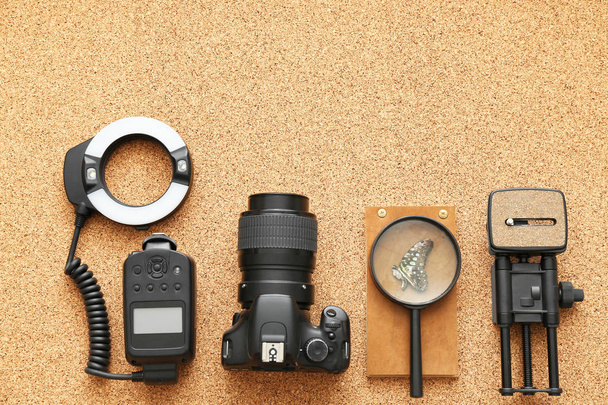 Modern equipment of professional photographer on cork background - Φωτογραφία, εικόνα