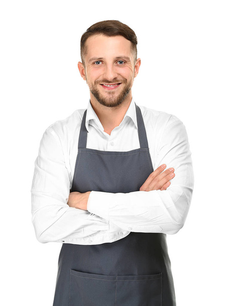 Handsome man in apron on white background - Foto, afbeelding