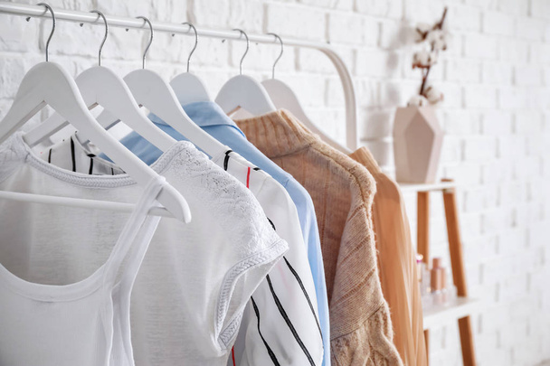 Rack with stylish clothes in dressing room - Φωτογραφία, εικόνα