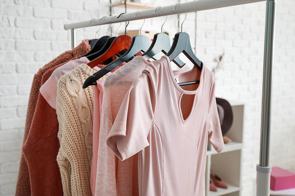 Rack with stylish clothes in dressing room - Foto, Imagen
