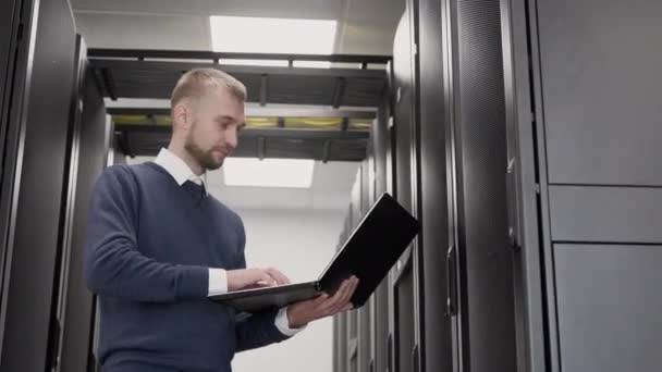 Server room in data center and support administrator with laptop - Footage, Video