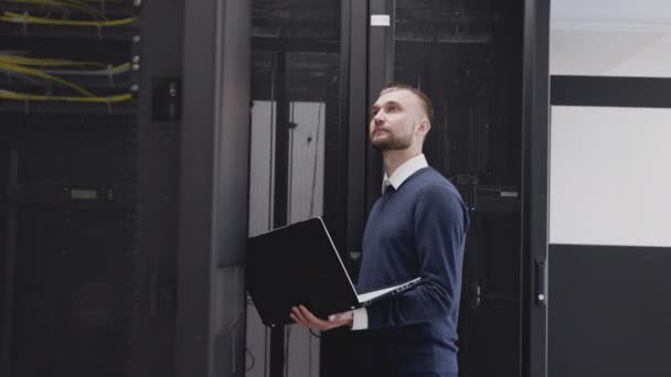 Server system support administrator walking in room of data center - Footage, Video