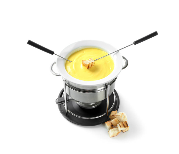 Fondue pot with melted cheese and bread on white background - Photo, Image