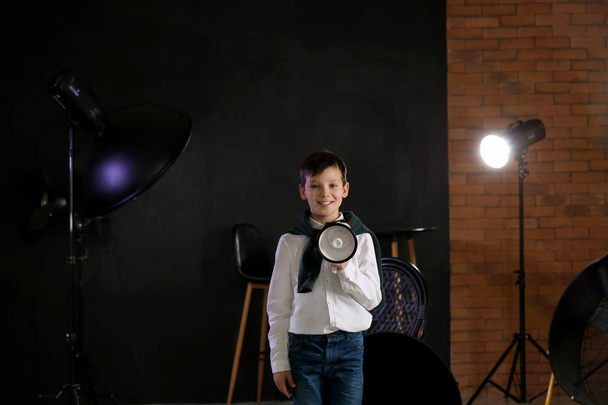Little film director with megaphone in studio - Photo, Image