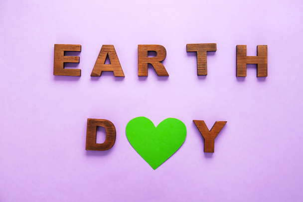 Text EARTH DAY on color background - Photo, Image