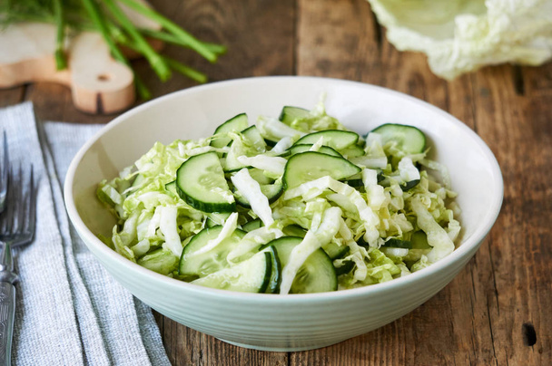 Salad with fresh chinese cabbage and cucumbers in a bowl                                - 写真・画像