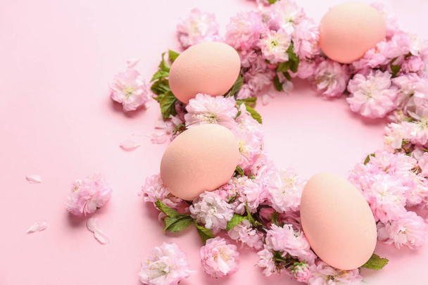 Beautiful Easter eggs with flowers on color background - Fotoğraf, Görsel