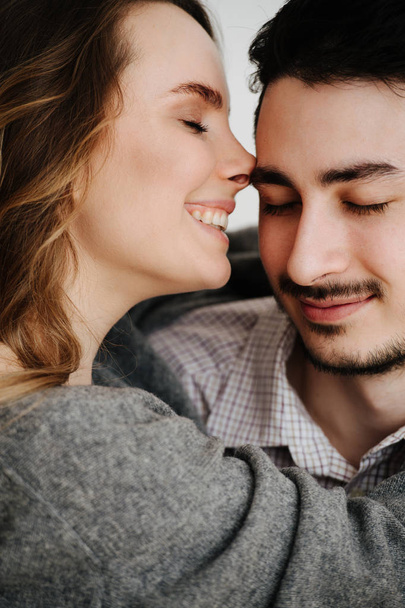 Beautiful couple is smiling and hugging while spending time together - Photo, Image