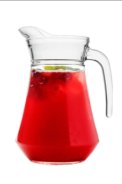 Berry, cherry drink in a glass jug on a white isolated background. - Foto, Bild