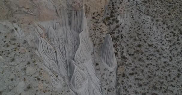 Flying towards eroded mountain slope from general to senital detail of strange water erosion formations. Abstract drawings. Coranzuli, Salta, Argentina - Séquence, vidéo