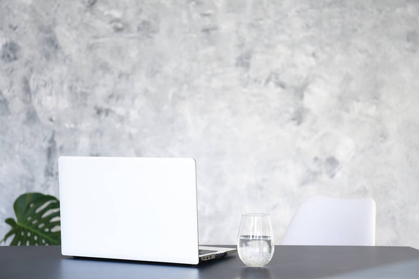Minimalistic composition of workplace with laptop and stationery. - Photo, Image