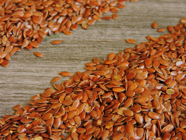 Flax seeds on a gray wooden background. Copy place. - Photo, Image