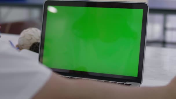 Woman working at home on with laptop green screen - Video
