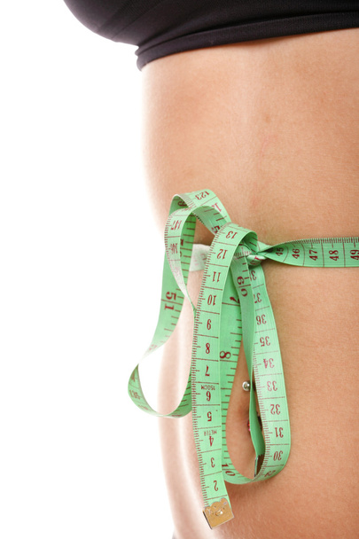 Mujer delgado estómago con cinta métrica a su alrededor
 - Foto, Imagen