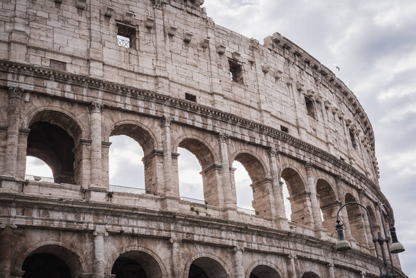 Closeup on the arches on the top of the Colosseum in Rome - 写真・画像