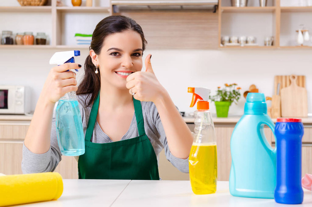 Young female contractor doing housework  - Photo, Image