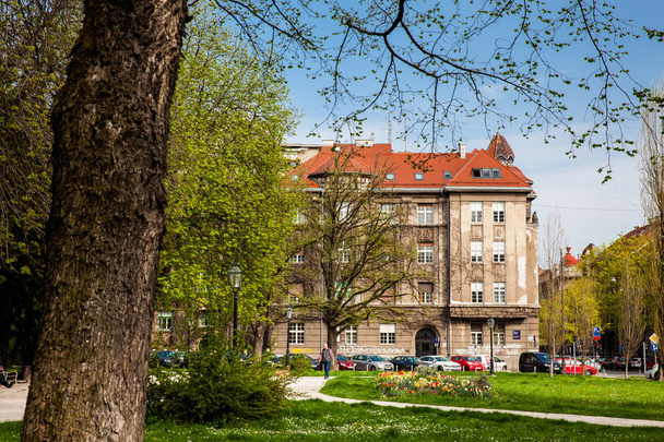 ZAGREB, CROATIA - APRIL, 2018: Beautiful park and the architecture of the buildings around the Republic Square in Zagreb - Photo, Image