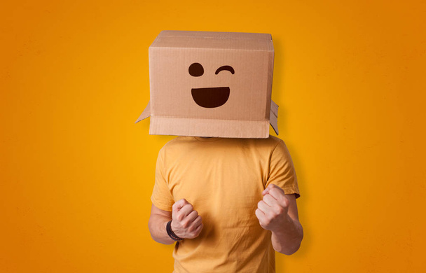 Funny man smiling with cardboard box head - Photo, Image