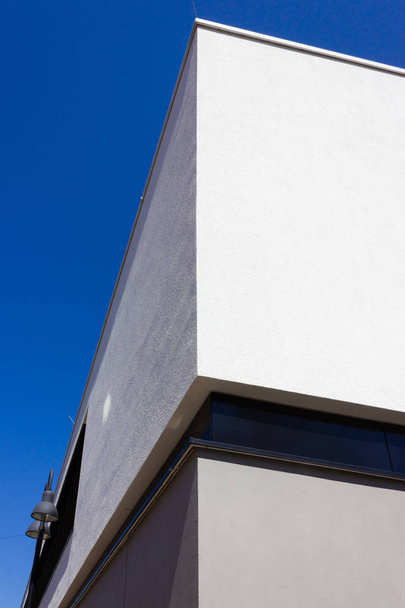 modern office building on blue sky white and grey wall in springtime april sunny morning - Photo, Image