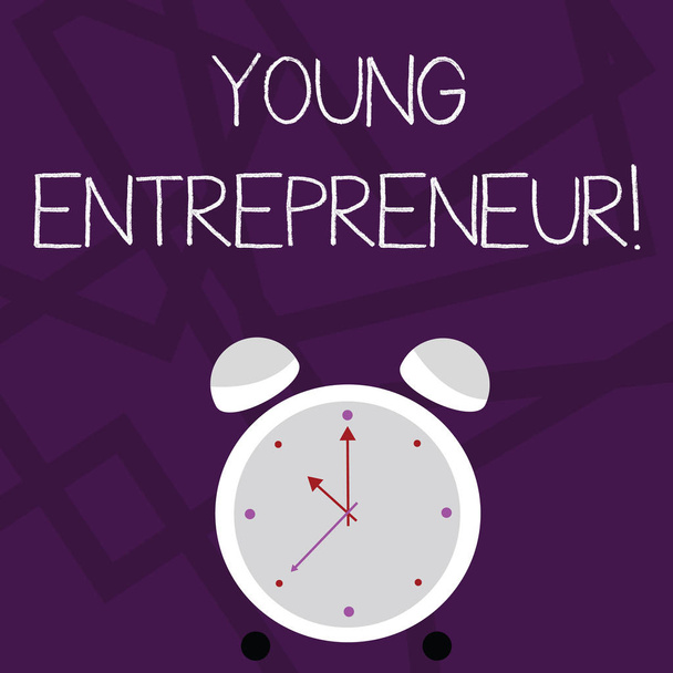 Writing note showing Young Entrepreneur. Business photo showcasing someone that started their own business at young age Colorful Round Analog Two Bell Alarm Desk Clock with Seconds Hand photo. - Photo, Image