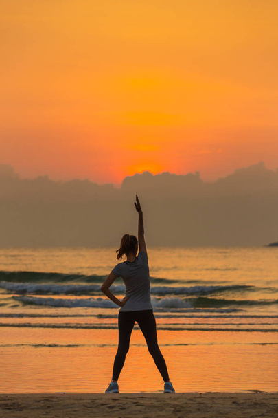 Woman exercise on beach - Zdjęcie, obraz