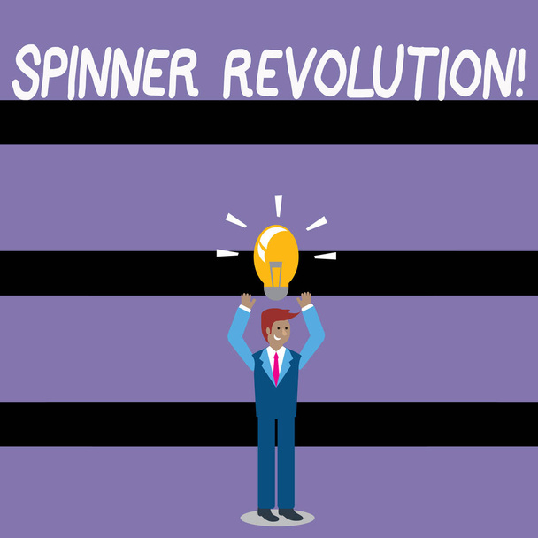 Writing note showing Spinner Revolution. Business photo showcasing a toy that help relieve stress and cope with anxiety Businessman Raising Arms Upward with Lighted Bulb icon above. - 写真・画像
