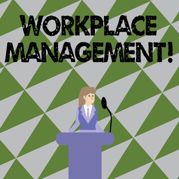 Text sign showing Workplace Management. Conceptual photo organizing things surrounding you in your working space Businesswoman Standing Behind Podium Rostrum Speaking on Wireless Microphone. - Photo, Image
