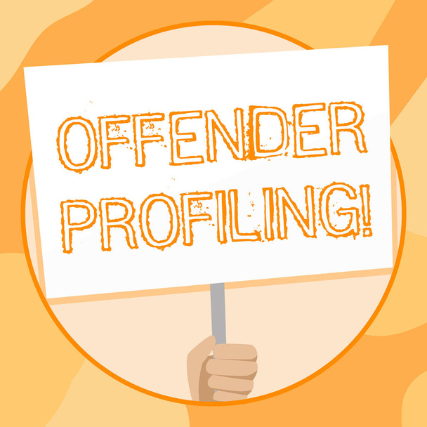 Handwriting text writing Offender Profiling. Concept meaning Develop profiles for offenders who not yet apprehended Hand Holding Blank White Placard Supported by Handle for Social Awareness. - Photo, Image