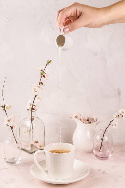 Gentle light minimalistic still life with a motion of cream pour - Φωτογραφία, εικόνα